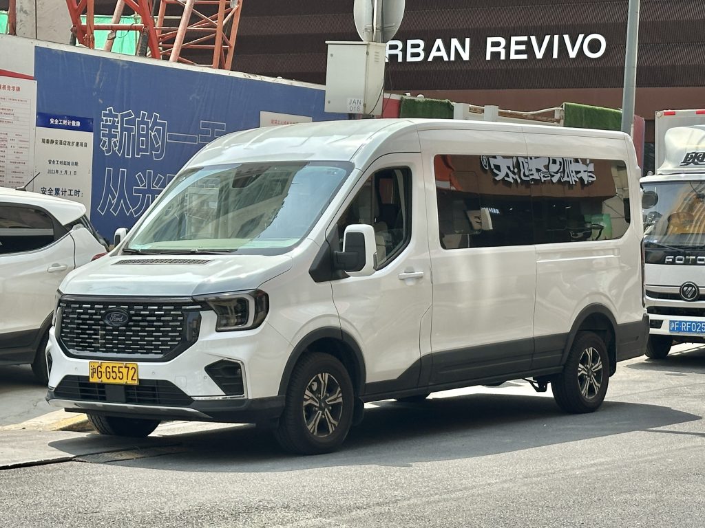 Ford Transit cargo van parked on city street representing commercial vehicle